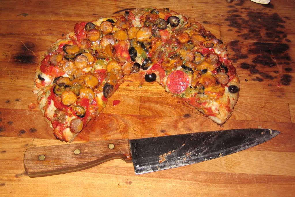 Grilled pizza on the board.